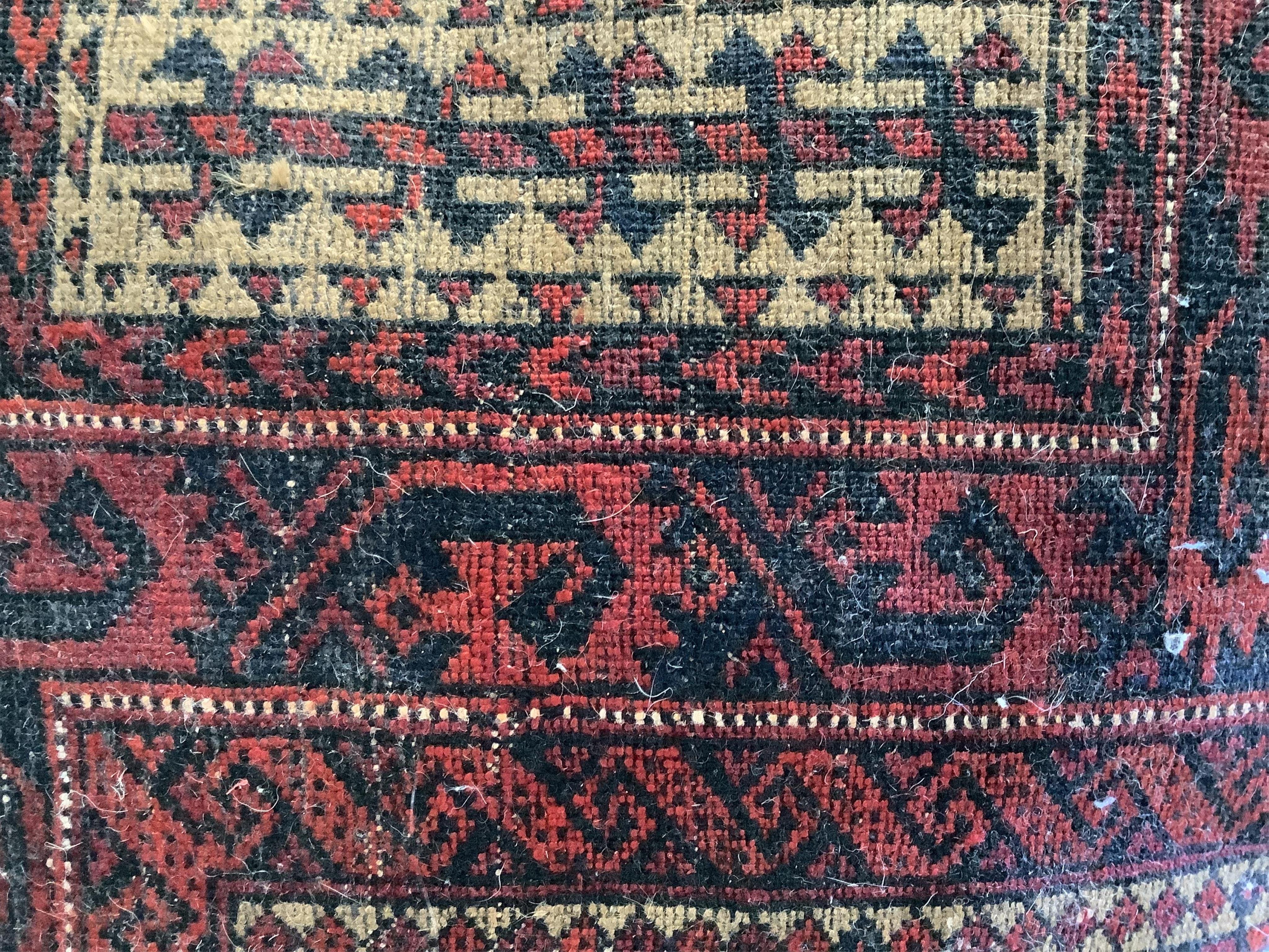 A Belouch red ground prayer rug, 142 x 96cm. Condition - fair